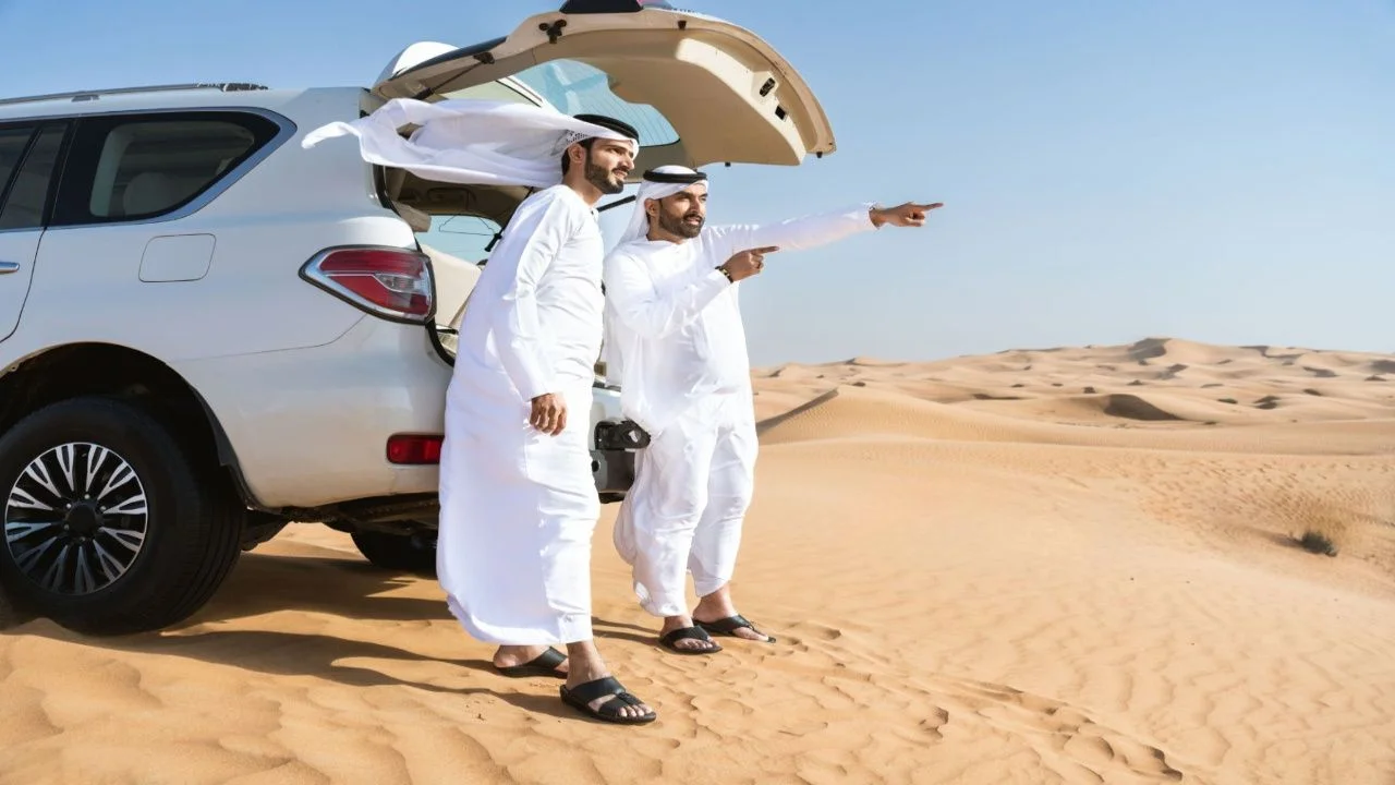 Two arabian men enjoying desert safari dubai marsa al arab