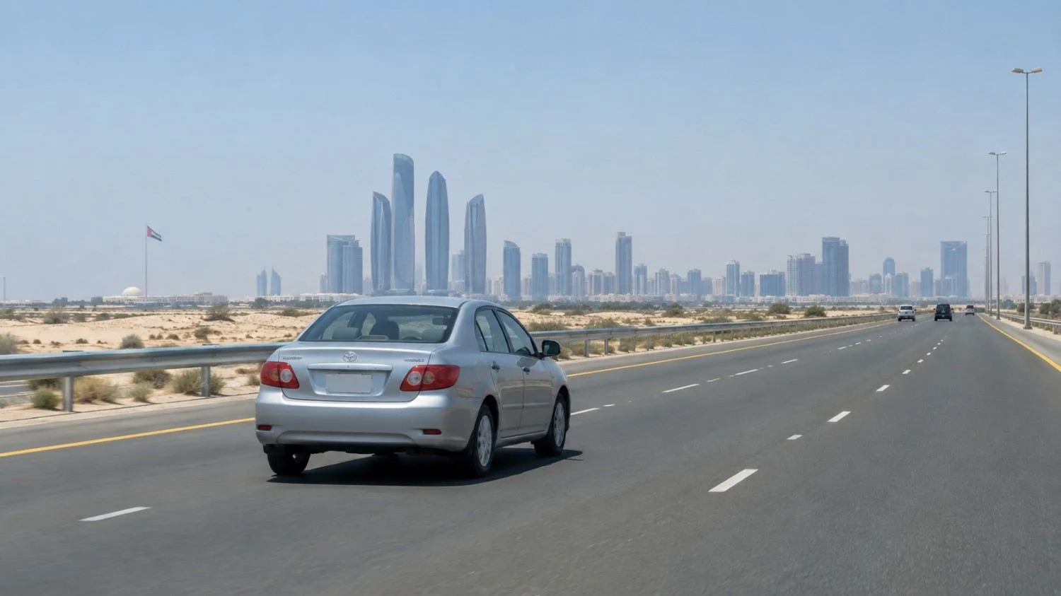 Rental car driving on the E11 Sheikh Zayed Road highway between Dubai and Abu Dhabi
